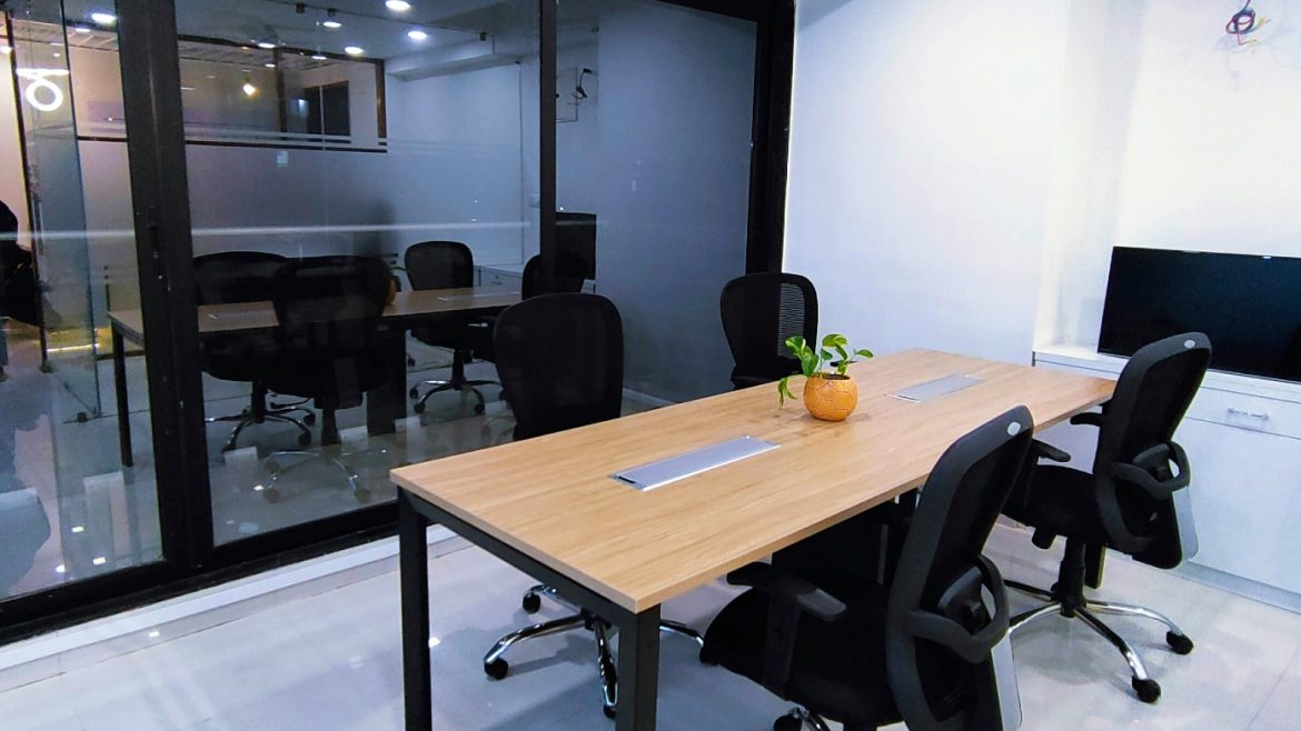 A room in an office building made by separating space with a glass partition wall.